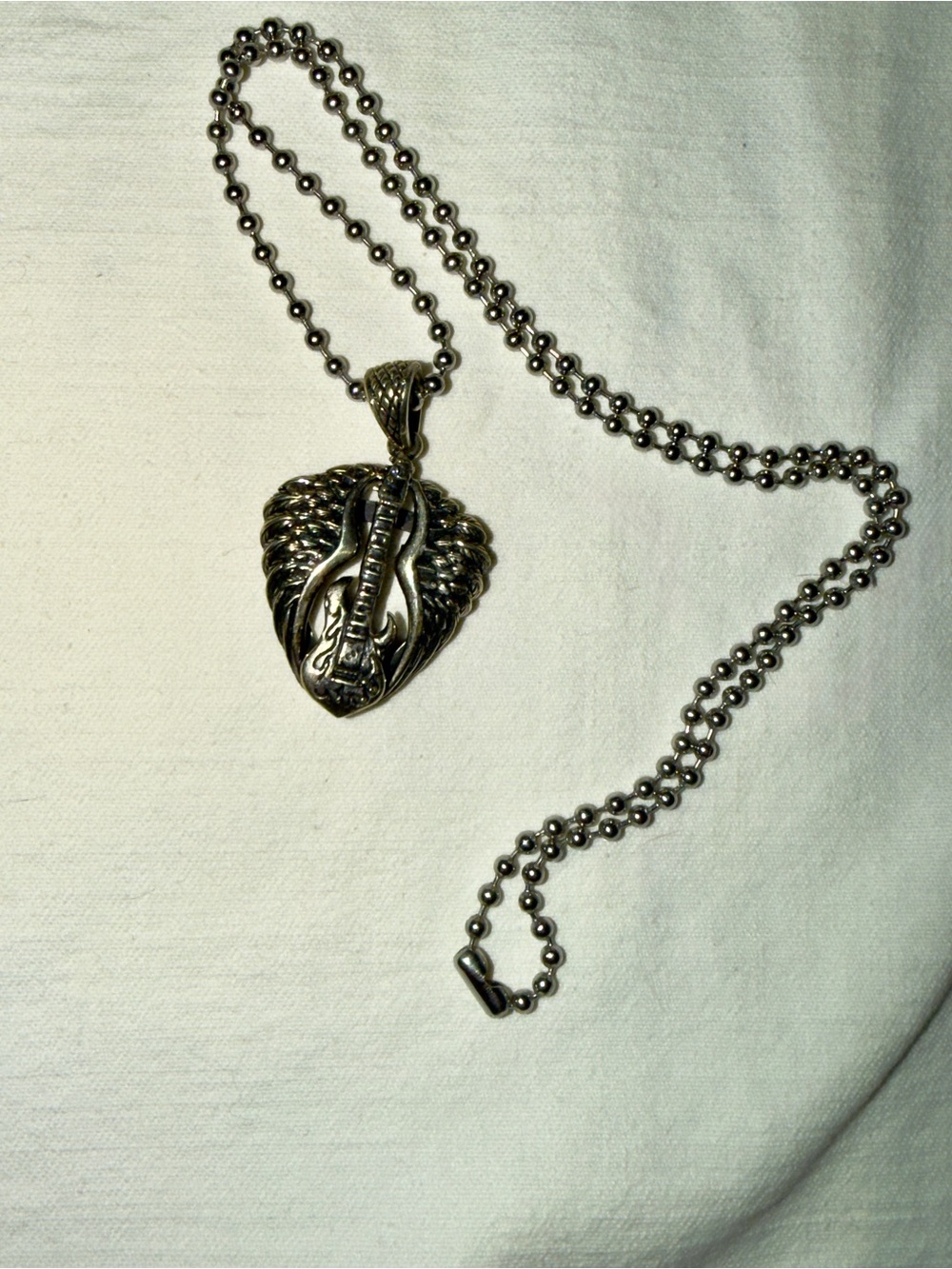 Rad Concert “pick” holder Pendant. 21” chain. Silver-Tone Guitar Wing design.